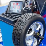 Why a spinning wheel shakes a car at highway speed and how a wheel balancer finds the heavy spot